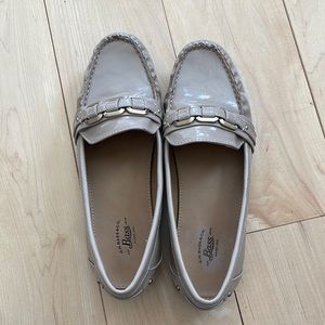 Women’s size 7.5 Bass patent leather loafer with gold hardware.